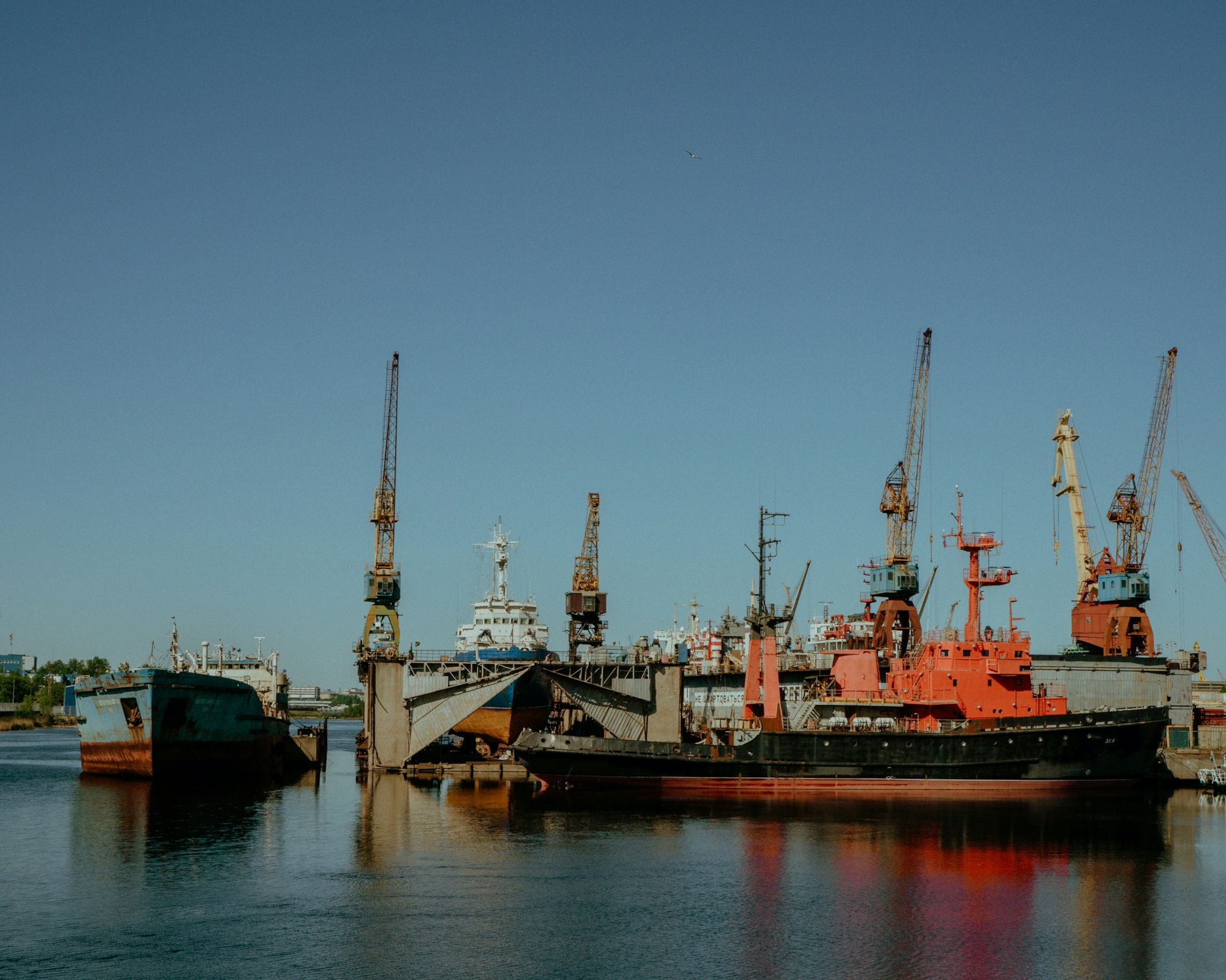 a large boat sitting in the middle of a body of water